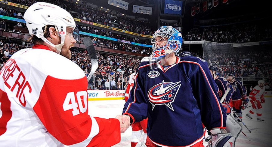 Steve Mason shakes Henrik Zetterberg's hand after the Columbus Blue Jackets were swept by the Detroit Red Wins in the 2009 Stanley Cup Playoffs.
