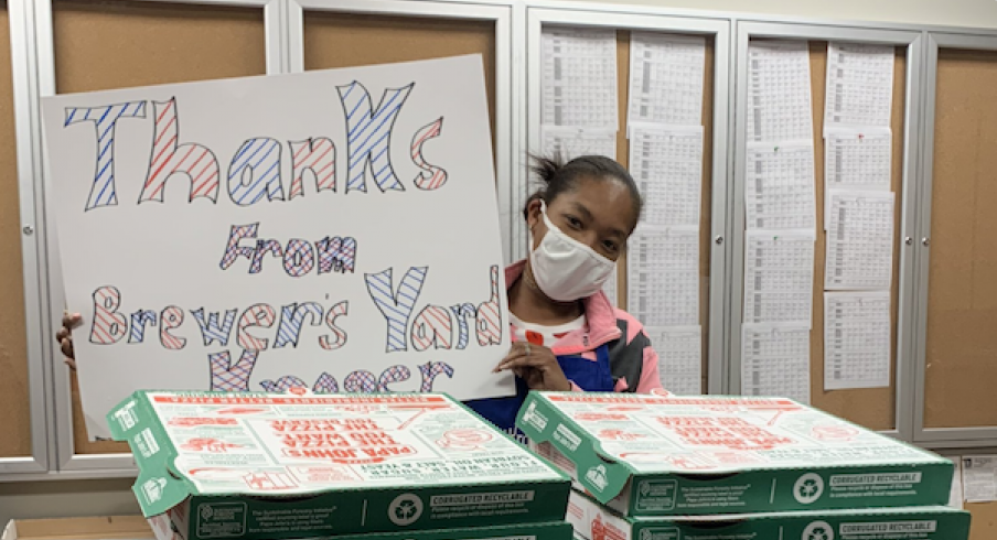 Employees at the Brewer's Yard Kroger in Columbus thank Columbus Blue Jackets forwards Pierre-Luc Dubois and Oliver Bjorkstrand for a pizza donation.