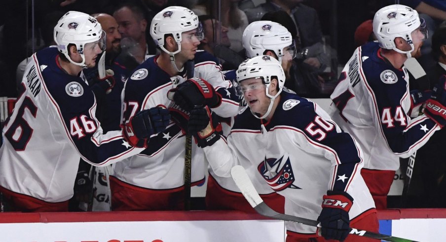 Nov 12, 2019; Montreal, Quebec, CAN; Columbus Blue Jackets forward Eric Robinson (50) reacts with teammates after scoring a goal against the Montreal Canadiens during the first period at the Bell Centre.