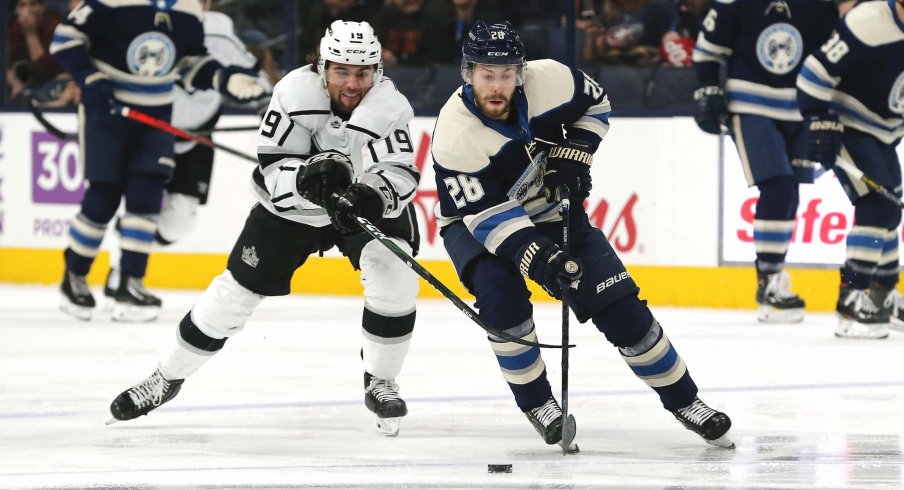Dec 19, 2019; Columbus, OH, USA; Columbus Blue Jackets right wing Oliver Bjorkstrand (28) skates with the puck as Los Angeles Kings left wing Alex Iafallo (19) defends during the first period at Nationwide Arena.