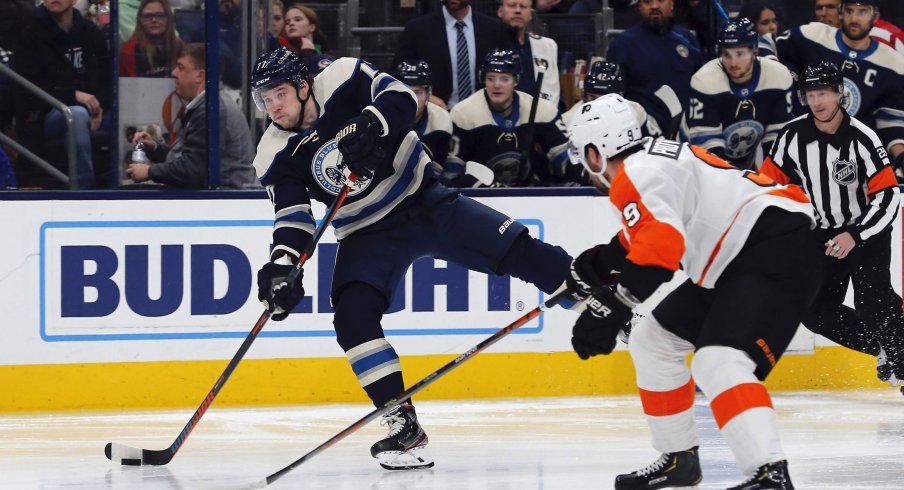 Nov 27, 2019; Columbus, OH, USA; Columbus Blue Jackets right wing Josh Anderson (77) wrists a shot on gaol as Philadelphia Flyers defenseman Ivan Provorov (9) defends during the second period at Nationwide Arena.