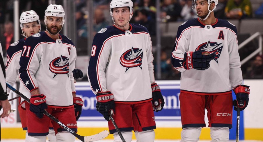 Jan 9, 2020; San Jose, California, USA; Columbus Blue Jackets left wing Nick Foligno (71) and defenseman Zach Werenski (8) and defenseman Seth Jones (3) react during the third period against the San Jose Sharks at SAP Center at San Jose.