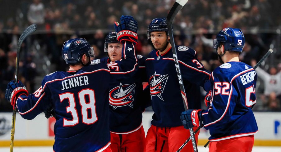 Columbus Blue Jackets defenseman Seth Jones (middle) celebrates with teammates \after scoring a goal against the Colorado Avalanche in the second period at Nationwide Arena.