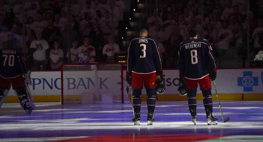 ct 12, 2019; Raleigh, NC, USA; Columbus Blue Jackets defenseman Zach Werenski (8) and Columbus Blue Jackets defenseman Seth Jones (3) looks on during the National Athem before the game against the Carolina Hurricanes at PNC Arena. The Columbus Blue Jackets defeated the Carolina Hurricanes 3-2.