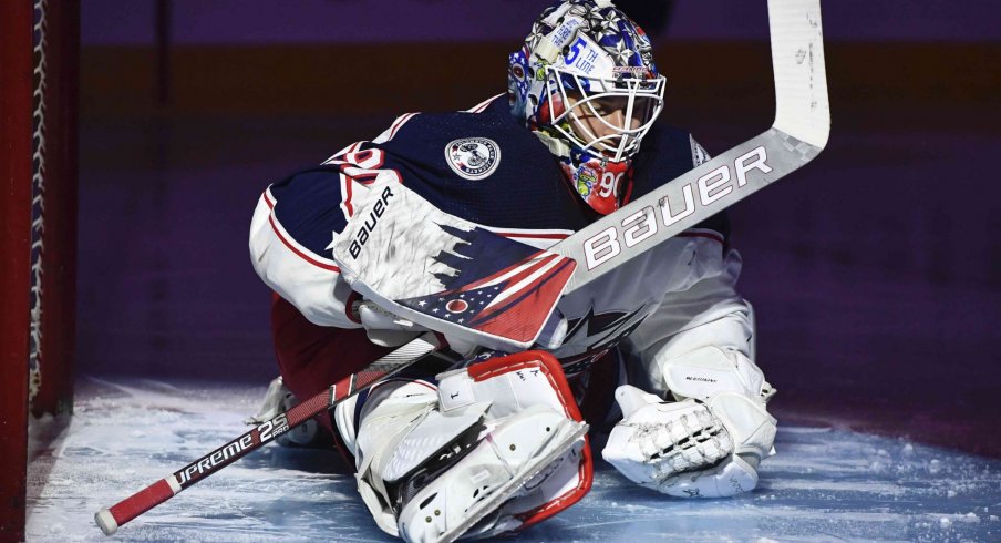 Columbus Blue Jackets goalie Elvis Merzlikins (90) stretches during the second period of the game against the Montreal Canadiens at the Bell Centre.