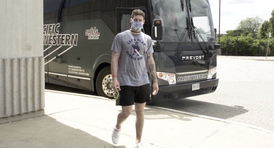 Pierre-Luc Dubois arrives at Scotiabank Arena in Toronto wearing a HOMAGE-branded "Let's Play Bubble Hockey" t-shirt.