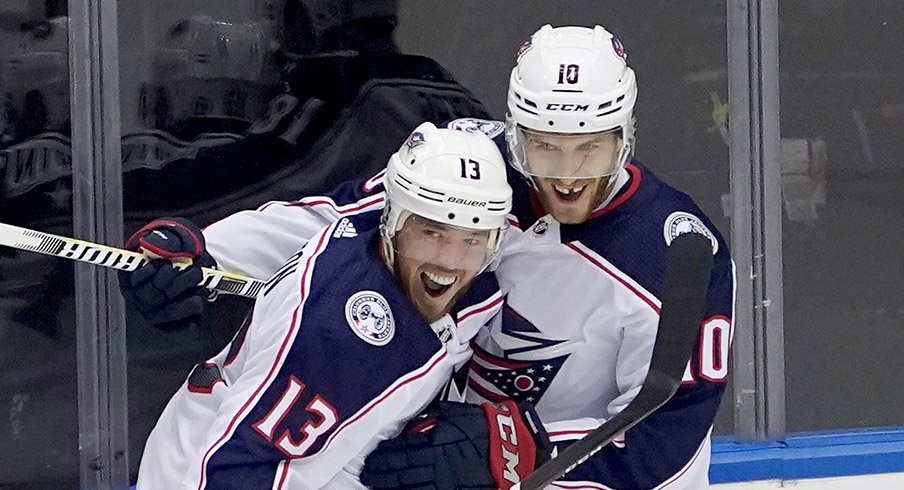 Cam Atkinson and Alexander Wennberg celebrate a goal against Toronto.