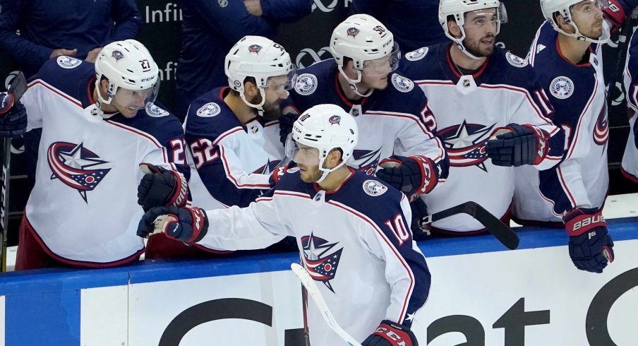 Aug 2, 2020; Toronto, Ontario, CANADA; Alexander Wennberg #10 of the Columbus Blue Jackets celebrates his empty net goal with teammates on the bench in the third period against the Toronto Maple Leafs in Game One of the Eastern Conference Qualification Round prior to the 2020 NHL Stanley Cup Playoffs at Scotiabank Arena on August 02, 2020 in Toronto, Ontario, Canada.