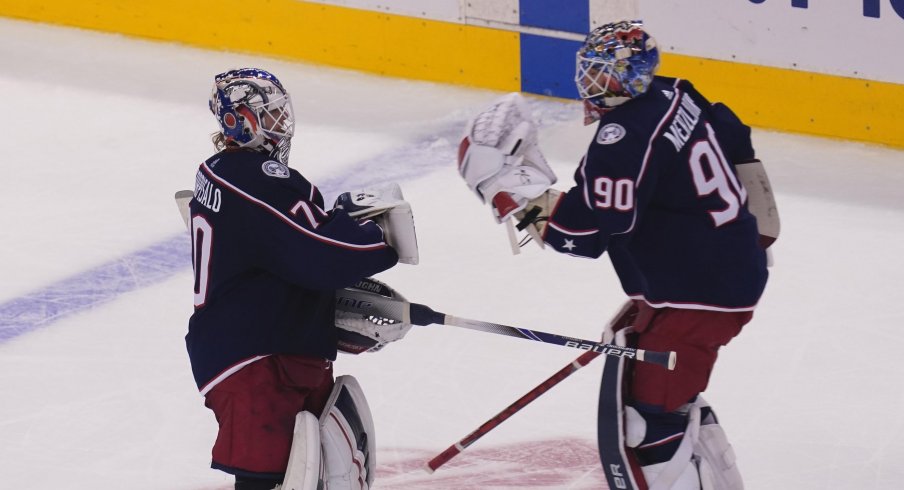 Columbus Blue Jackets goaltender Joonas Korpisalo (70) heads for the bench as he is replaced by goaltender Elvis Merzlikins (90) during the second period against the Toronto Maple Leafs in the Eastern Conference qualifications at Scotiabank Arena.