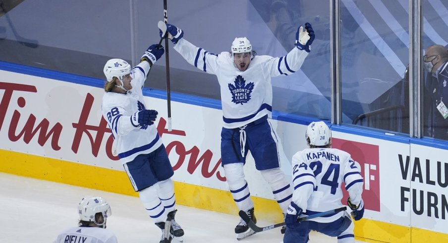 Auston Matthews celebrates after scoring the overtime game-winner in Game 4