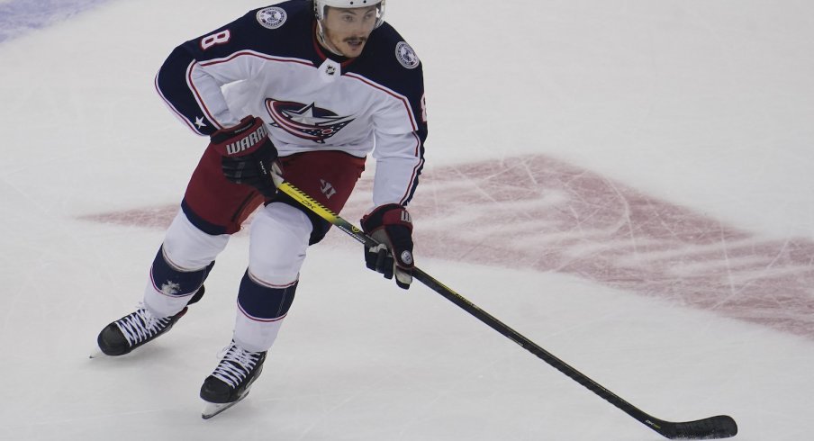 Columbus Blue Jackets defenseman Zach Werenski carries the puck against the Toronto Maple Leafs during the first period of game five of the Eastern Conference qualifications at Scotiabank Arena.