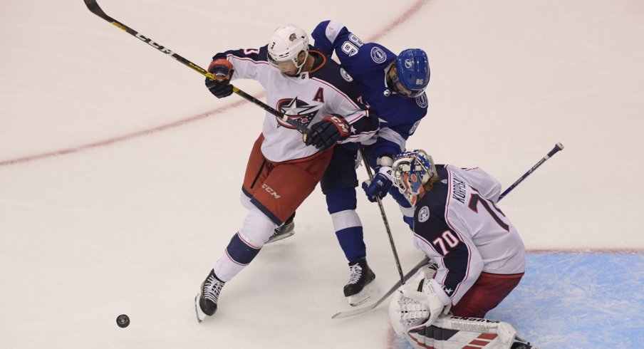 Aug 11, 2020; Toronto, Ontario, CAN; Tampa Bay Lightning right wing Nikita Kucherov (86) and Columbus Blue Jackets defenseman Seth Jones (3) battle for the puck in front of Blue Jackets goaltender Joonas Korpisalo (70) in the first overtime in game one of the first round of the 2020 Stanley Cup Playoffs at Scotiabank Arena.