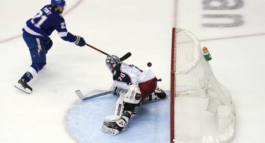 Tampa Bay Lightning center Brayden Point (21) shoots to score a goal against Columbus Blue Jackets goaltender Joonas Korpisalo (70) during the overtime period in game five of the first round of the 2020 Stanley Cup Playoffs at Scotiabank Arena.