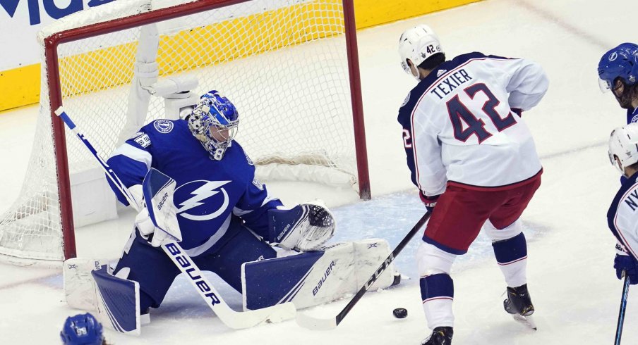 Tampa Bay Lightning goaltender Andrei Vasilevskiy (88) blocks a shot against Columbus Blue Jackets center Alexandre Texier (42) during the second period in game five of the first round of the 2020 Stanley Cup Playoffs at Scotiabank Arena.