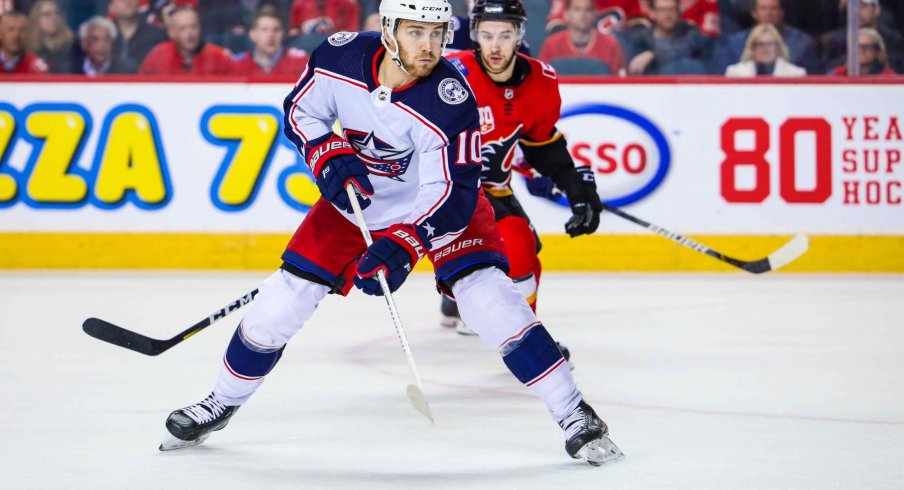 Mar 4, 2020; Calgary, Alberta, CAN; Columbus Blue Jackets center Alexander Wennberg (10) controls the puck against the Calgary Flames during the overtime period at Scotiabank Saddledome.