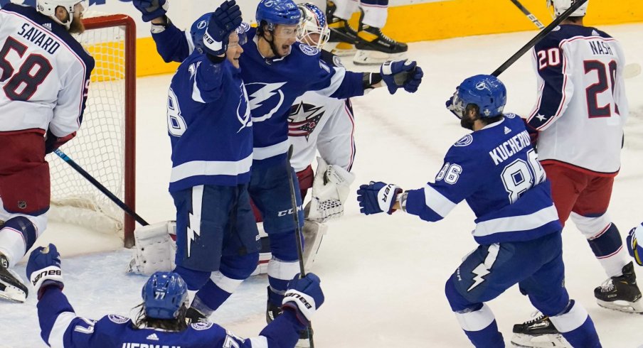 Aug 19, 2020; Toronto, Ontario, CAN; Tampa Bay Lightning forward Anthony Cirelli (71) celebrates scoring the tying goal with forward Ondrej Palat (18) and forward Nikita Kucherov (86) against Columbus Blue Jackets goaltender Joonas Korpisalo (70) to force overtime in game five of the first round of the 2020 Stanley Cup Playoffs at Scotiabank Arena.