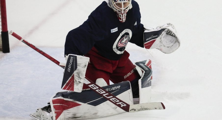 Elvis Merzlikins, getting some work in during practice Monday, excelled in goal after a rocky start filling in for the injured Joonas Korpisalo.