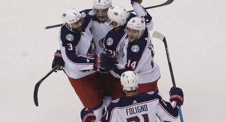 Aug 9, 2020; Toronto, Ontario, CAN; Columbus Blue Jackets forward Gustav Nyquist (14) and forward Boone Jenner (38)and defenseman Seth Jones (3) and forward Nick Foligno (71) celebrate a goal by defenseman Zach Werenski (8) against the Toronto Maple Leafs during the first period of game five of the Eastern Conference qualifications at Scotiabank Arena.