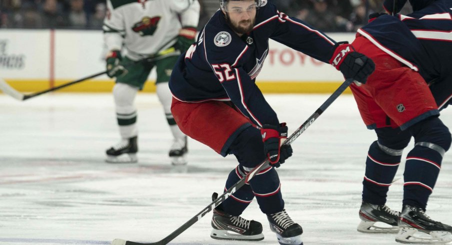 Feb 28, 2020; Columbus, Ohio, USA; Columbus Blue Jackets center Emil Bemstrom (52) looks to pass the puck during the game against the Minnesota Wild at Nationwide Arena.