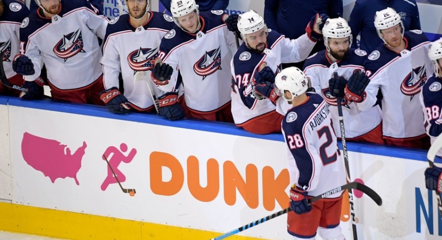 Columbus Blue Jackets right wing Oliver Bjorkstrand (28) celebrates his goal against the Tampa Bay Lightning with teammates during the first period in game two of the first round of the 2020 Stanley Cup Playoffs at Scotiabank Arena. 