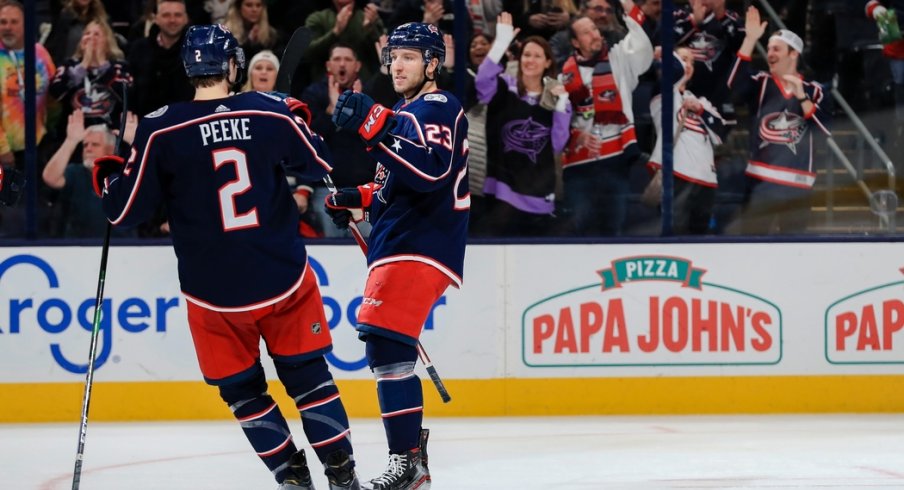 Columbus Blue Jackets defenseman Andrew Peeke (2) celebrates after center Stefan Matteau (23) scores a goal against the Ottawa Senators in the third period at Nationwide Arena.