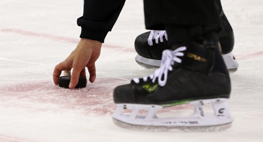  A NHL official collects the off ice Columbus Blue Jackets puck off the ice at Nationwide Arena. The Blue Jackets won 1-0. 