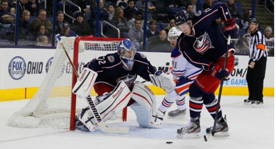 Former Blue Jacket Ryan Johansen clears the puck in front of former Blue Jacket Sergei Bobrovsky. 