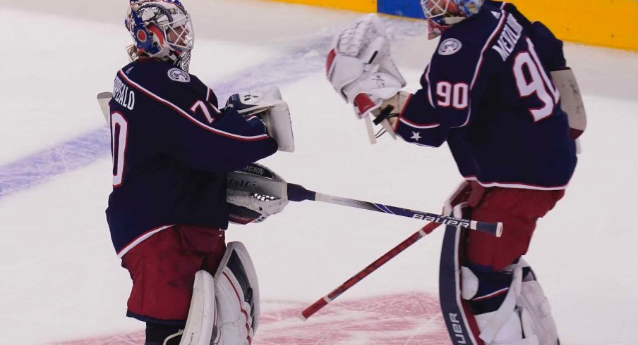 Aug 6, 2020; Toronto, Ontario, CAN; Columbus Blue Jackets goaltender Joonas Korpisalo (70) heads for the bench as he is replaced by goaltender Elvis Merzlikins (90) during the second period against the Toronto Maple Leafs in the Eastern Conference qualifications at Scotiabank Arena.