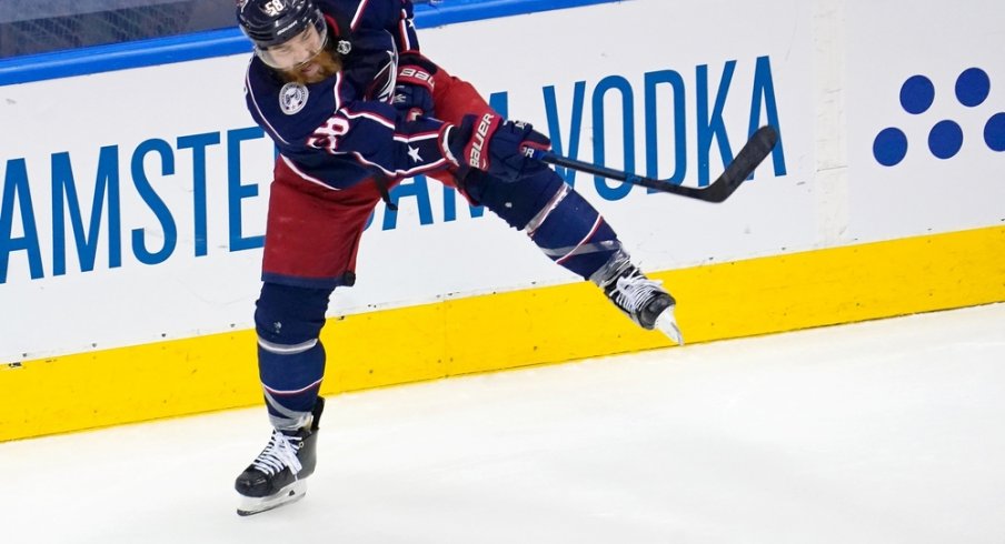 Columbus Blue Jackets defenseman David Savard (58) clears the puck against the Tampa Bay Lightning during the second period of game three of the first round of the 2020 Stanley Cup Playoffs at Scotiabank Arena.