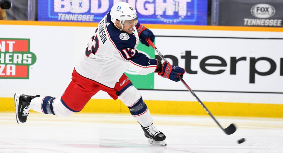 Jan 14, 2021; Nashville, Tennessee, USA; Columbus Blue Jackets forward Cam Atkinson (13) attempts a shot during the second period against the Nashville Predators at Bridgestone Arena.