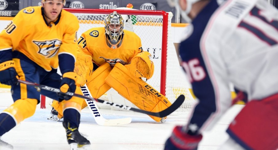 Nashville Predators goaltender Juuse Saros (74) waits for a shot from Max Domi (16) during the second period at Bridgestone Arena. 