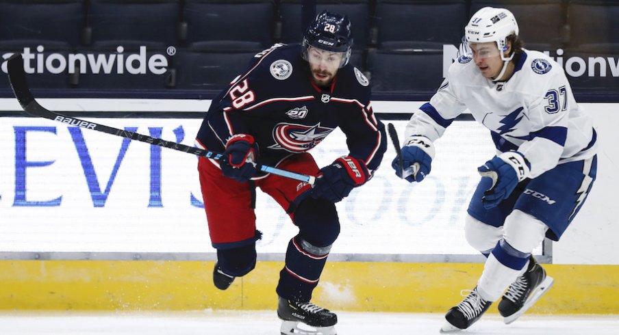 Columbus Blue Jackets right wing Oliver Bjorkstrand (28) skates against Tampa Bay Lightning center Yanni Gourde (37) in the first period at Nationwide Arena.