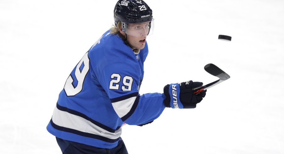 Winnipeg Jets right wing Patrik Laine (29) puck juggles in warm up before a game against the New York Islanders at Bell MTS Place.