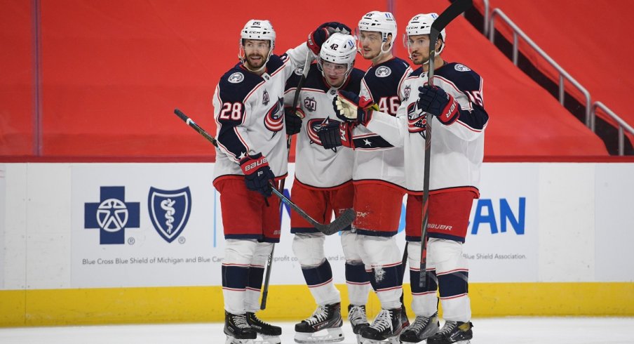 Alexandre Texier celebrates with teammates after scoring a goal against the Detroit Red Wings