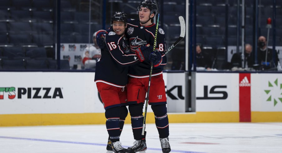 Columbus Blue Jackets center Max Domi (16) celebrates with teammates defenseman Zach Werenski (8) after scoring a goal against the Florida Panthers in the third period at Nationwide Arena.