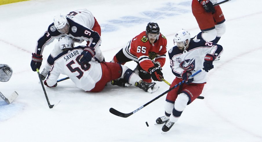 Jan 29, 2021; Chicago, Illinois, USA; Columbus Blue Jackets right wing Oliver Bjorkstrand (28) gets control of the puck against the Chicago Blackhawks during the first period at United Center.