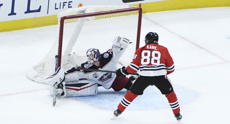 Columbus Blue Jackets goaltender Joonas Korpisalo (70) makes qa save on Chicago Blackhawks right wing Patrick Kane (88) during the third period at United Center.