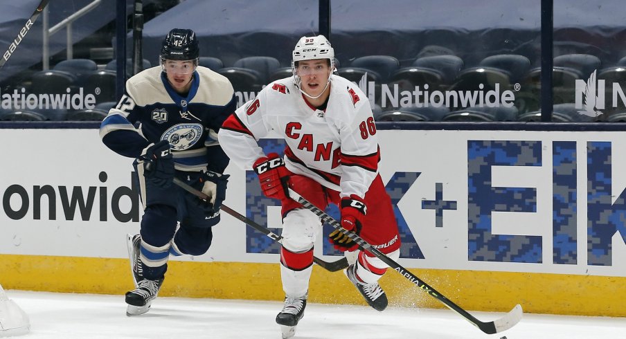 Carolina Hurricanes winger Teuvo Teravainen carries the puck as Columbus Blue Jackets center Alexandre Texier trails the play during the first period at Nationwide Arena.