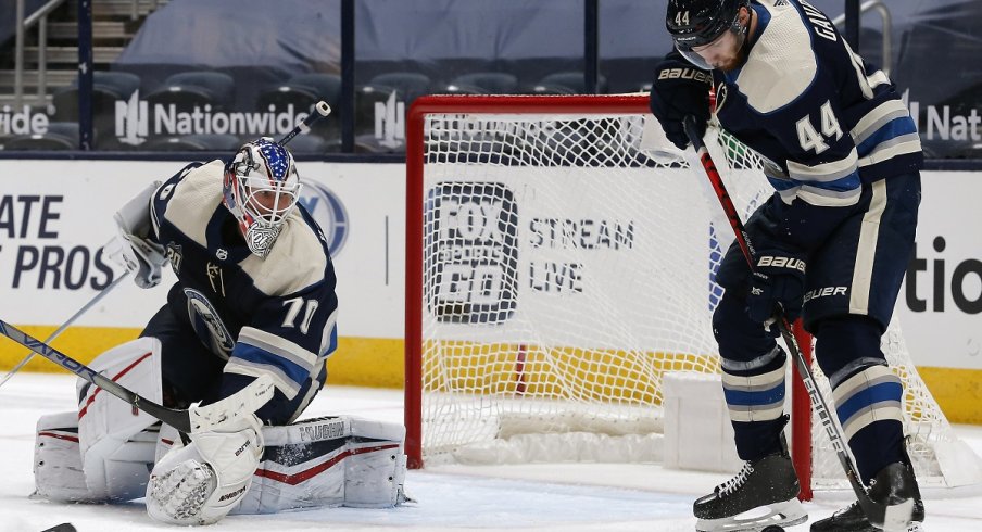 Vladislav Gavrikov attempts to play a rebound against the Carolina Hurricanes