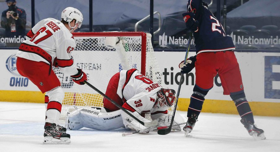 Feb 8, 2021; Columbus, Ohio, USA; Carolina Hurricanes goalie Alex Nedeljkovic (39) stops the shot attempt from Columbus Blue Jackets right wing Patrik Laine (29) during the first period at Nationwide Arena.
