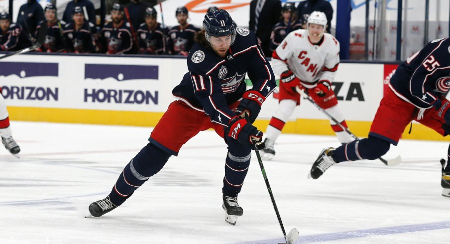 Columbus Blue Jackets center Kevin Stenlund stick handles against the Carolina Hurricanes during the first period at Nationwide Arena.