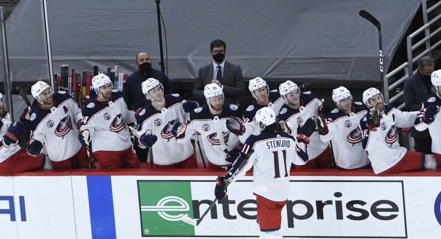 Feb 11, 2021; Chicago, Illinois, USA; Columbus Blue Jackets center Kevin Stenlund (11) celebrates his game winning goal against the Chicago Blackhawks during the third period at United Center.