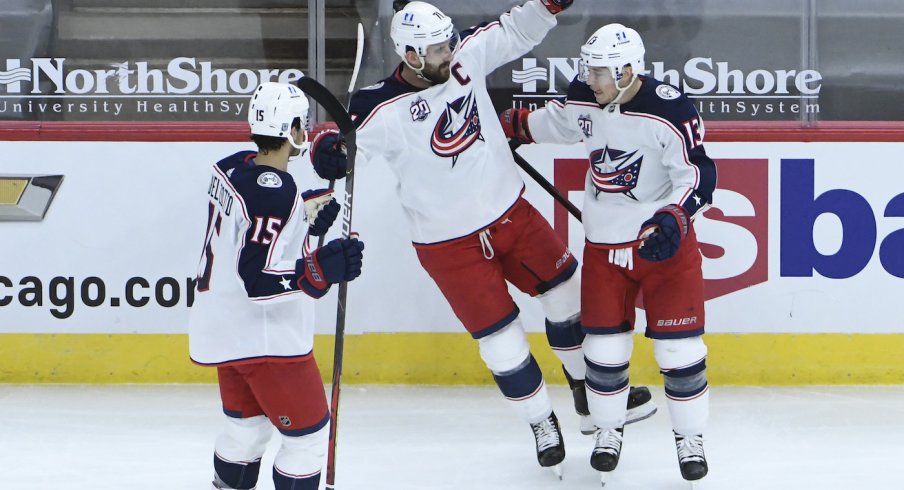 Columbus Blue Jackets right wing Cam Atkinson (13) celebrates his goal against the Chicago Blackhawks with Jackets left wing Nick Foligno (71) during the first period at United Center.