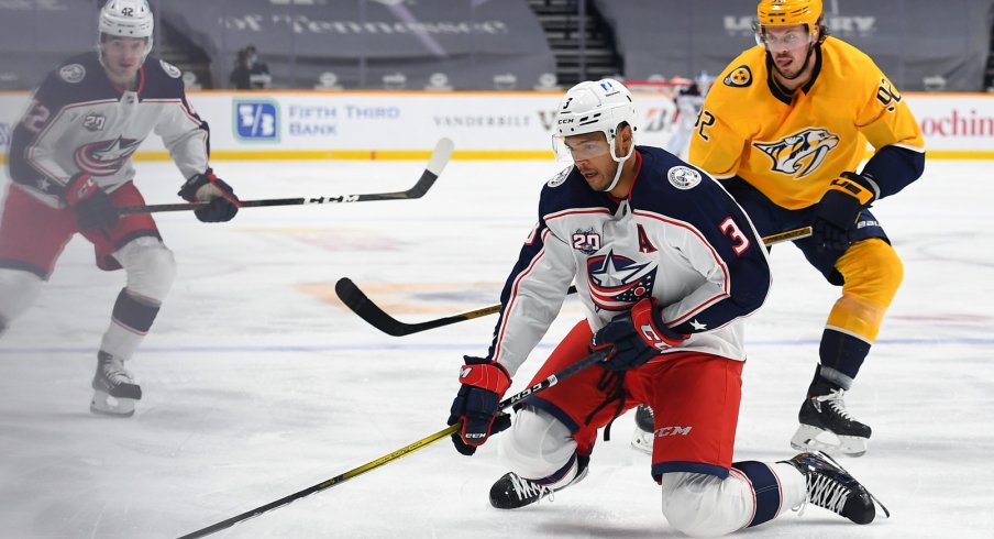Columbus Blue Jackets defenseman Seth Jones controls the puck from his knees as he enters the offensive zone against the Nashville Predators during their first meeting of the season.