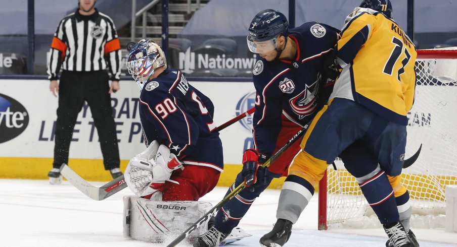 Feb 18, 2021; Columbus, Ohio, USA; Columbus Blue Jackets goalie Elvis Merzlikins (90) makes a save against the Nashville Predators during the second period at Nationwide Arena.