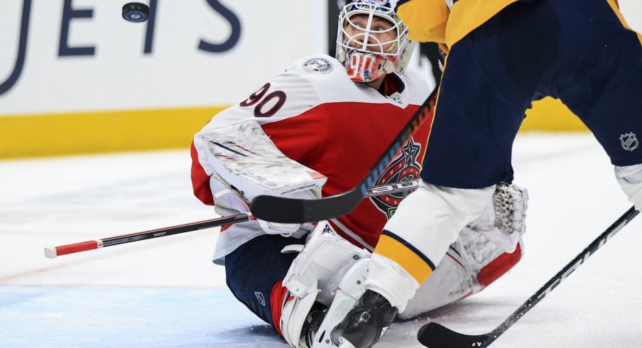 Columbus Blue Jackets goaltender Elvis Merzlikins follows the puck in the air in the game against the Nashville Predators in the second period at Nationwide Arena. 