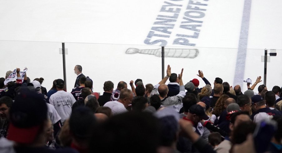 Apr 16, 2019; Columbus, OH, USA; A view of the Stanley Cup Playoffs logo on the ice as fans celebrate the Columbus Blue Jackets defeated the Tampa Bay Lightning in game four of the first round of the 2019 Stanley Cup Playoffs at Nationwide Arena.
