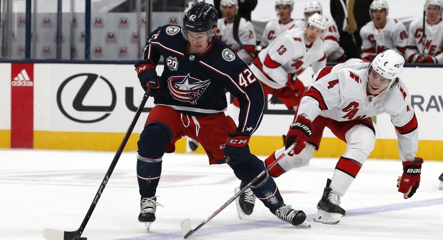 Alexandre Texier protects the puck from the Carolina Hurricanes