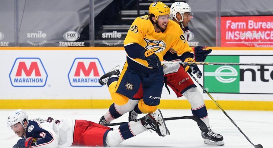  Nashville Predators center Matt Duchene (95) is hit by Columbus Blue Jackets defenseman Zach Werenski (8) and defenseman Seth Jones (3) as he skates toward the net during the third period at Bridgestone Arena.