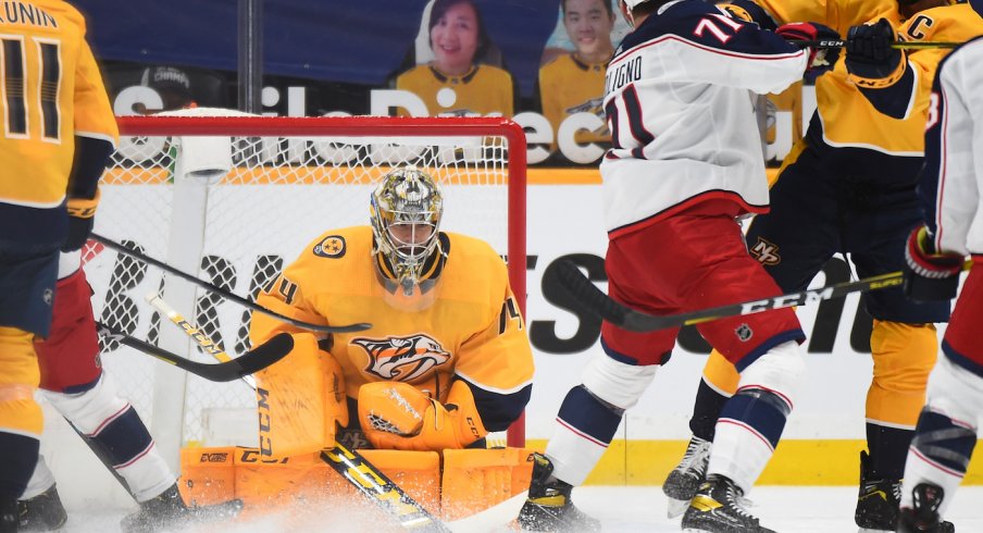 Nashville Predators goaltender Juuse Saros (74) makes a save during the first period against the Columbus Blue Jackets at Bridgestone Arena. 